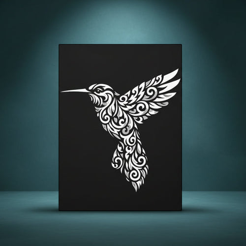 Black and white rhinestone canvas art of a hummingbird in flight, filled with intricate tribal and floral scrollwork detailing, mounted on a gallery-wrapped matte canvas with a deep black background.