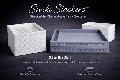 Stackable rhinestone tray system with 2 large gray trays and 8 smaller white trays.